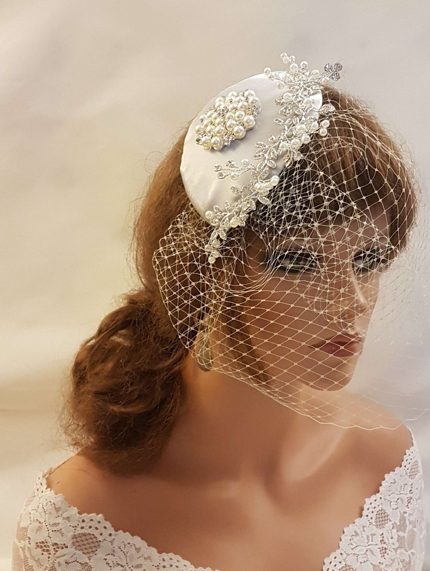 BRIDAL FASCINATOR in Silver Grey, White, Ivory, Champagne Pale Pink with birdcage veil and hat, adorned with crystal and pearl embellishments.