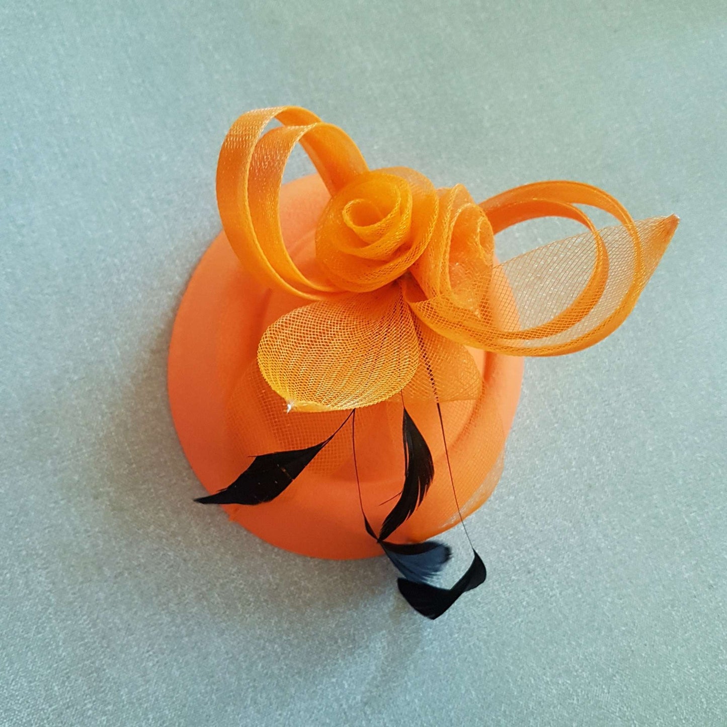 Orange 40s 50s vintage fascinator hat with feather flower for races and cocktail parties