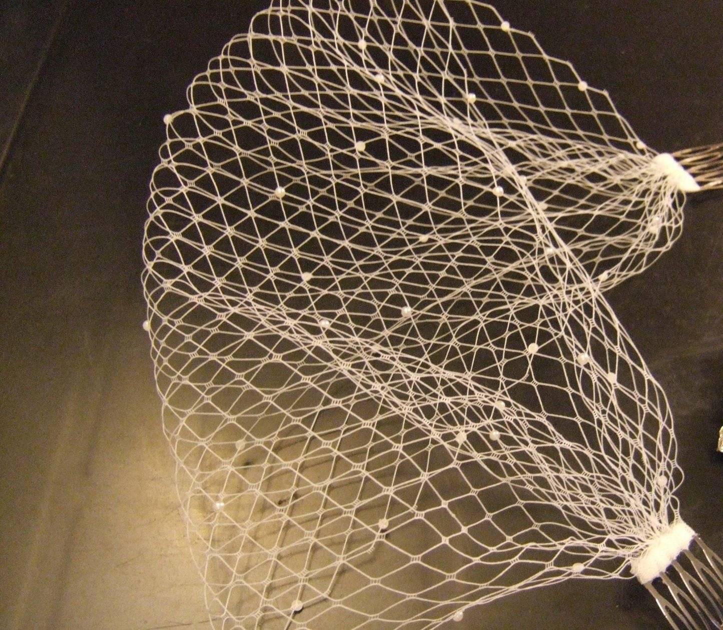 Birdcage veil with lace fascinator and pearls in white and ivory for weddings.