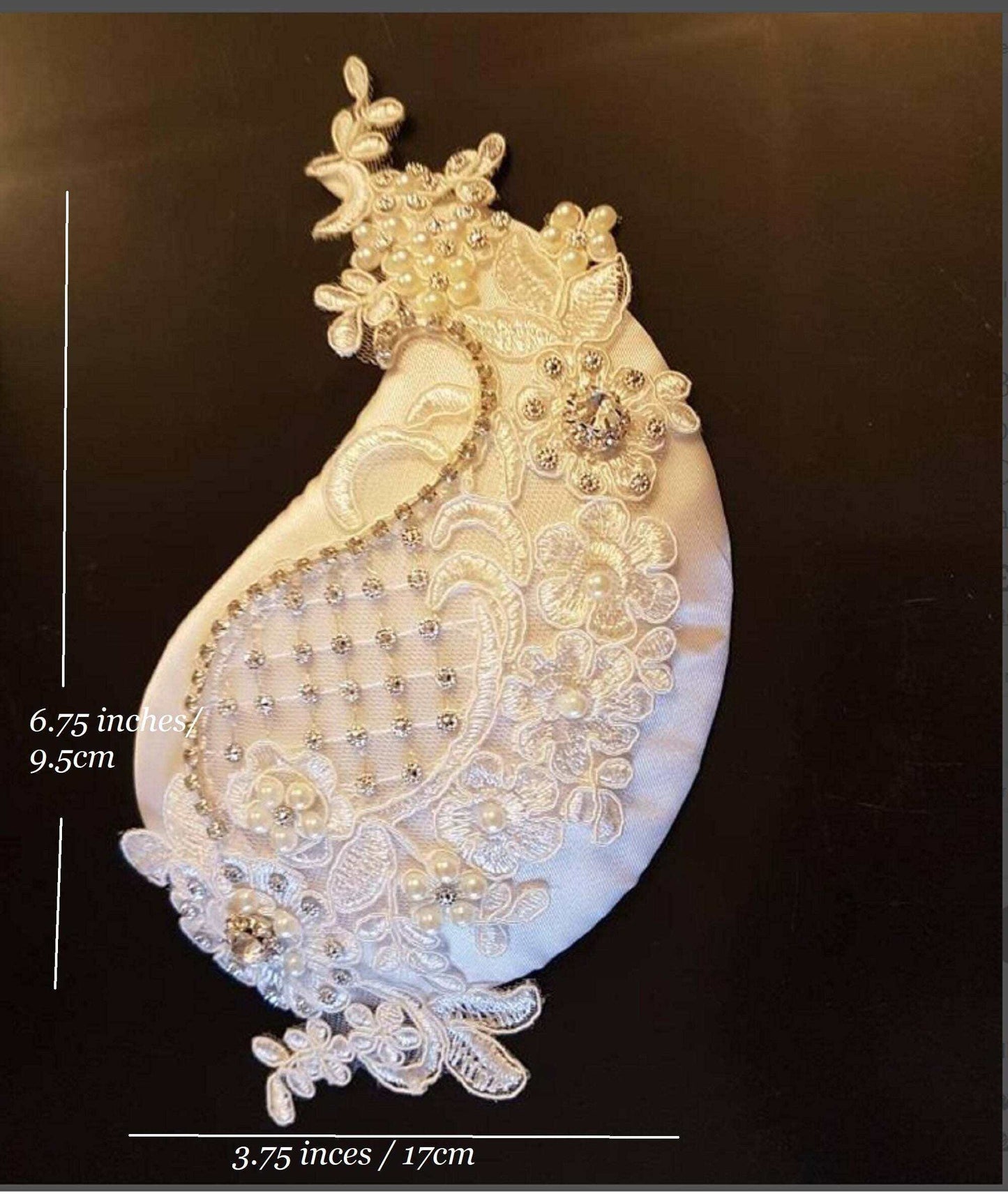Bridal birdcage veil fascinator with intricate crystal and pearl embellishments, vintage-inspired design.