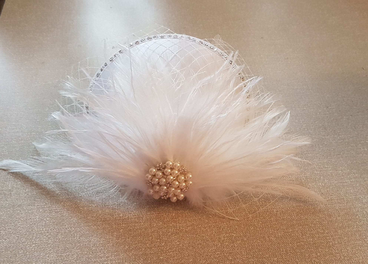 White ivory feather hat fascinator with pearl and crystal jewel, French netting; wedding hair accessory.