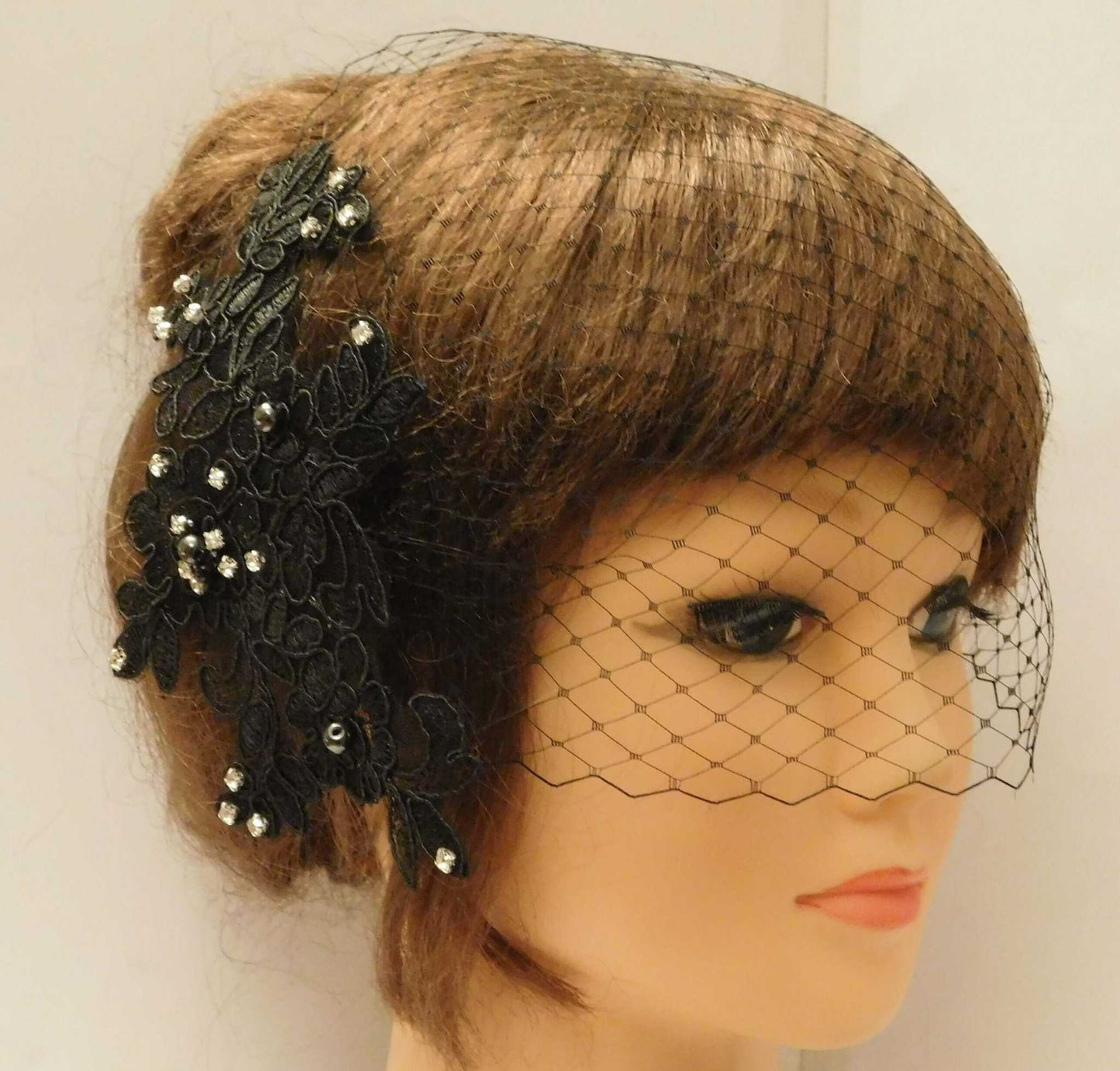 White and Ivory bridal birdcage veil with lace fascinator, pearls, and diamonte blusher for wedding hair accessory.