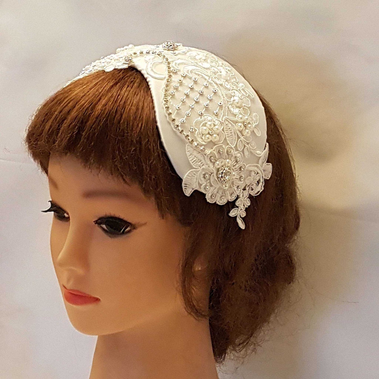 Bridal birdcage veil fascinator with vintage embellishments and satin finish, headpiece for weddings.