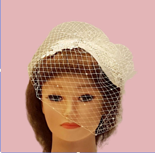 Bridal hat fascinator with Birdcage veil