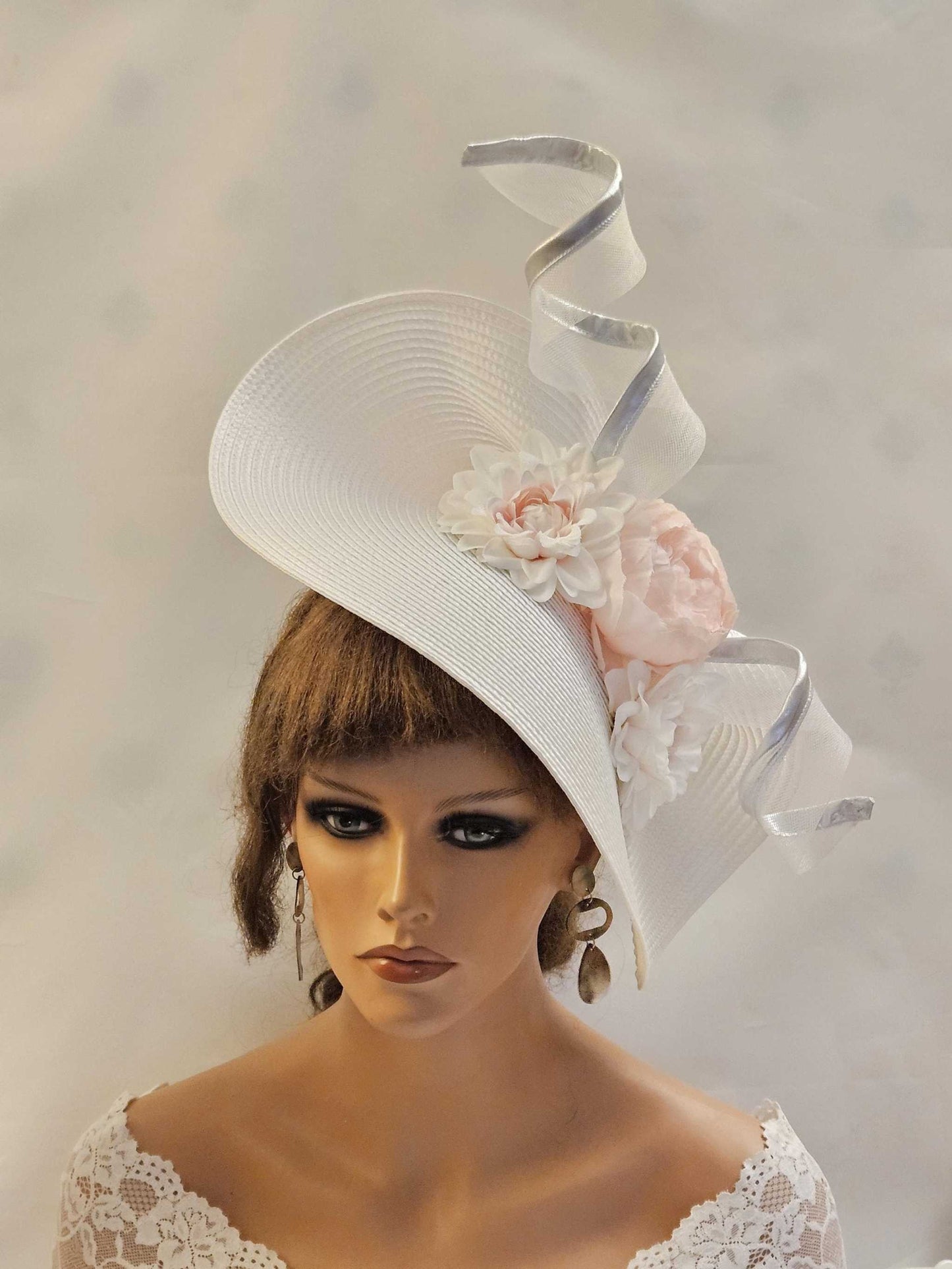 White and pink mother of the bride hat fascinator with silver edged crinoline swirl and silk flowers