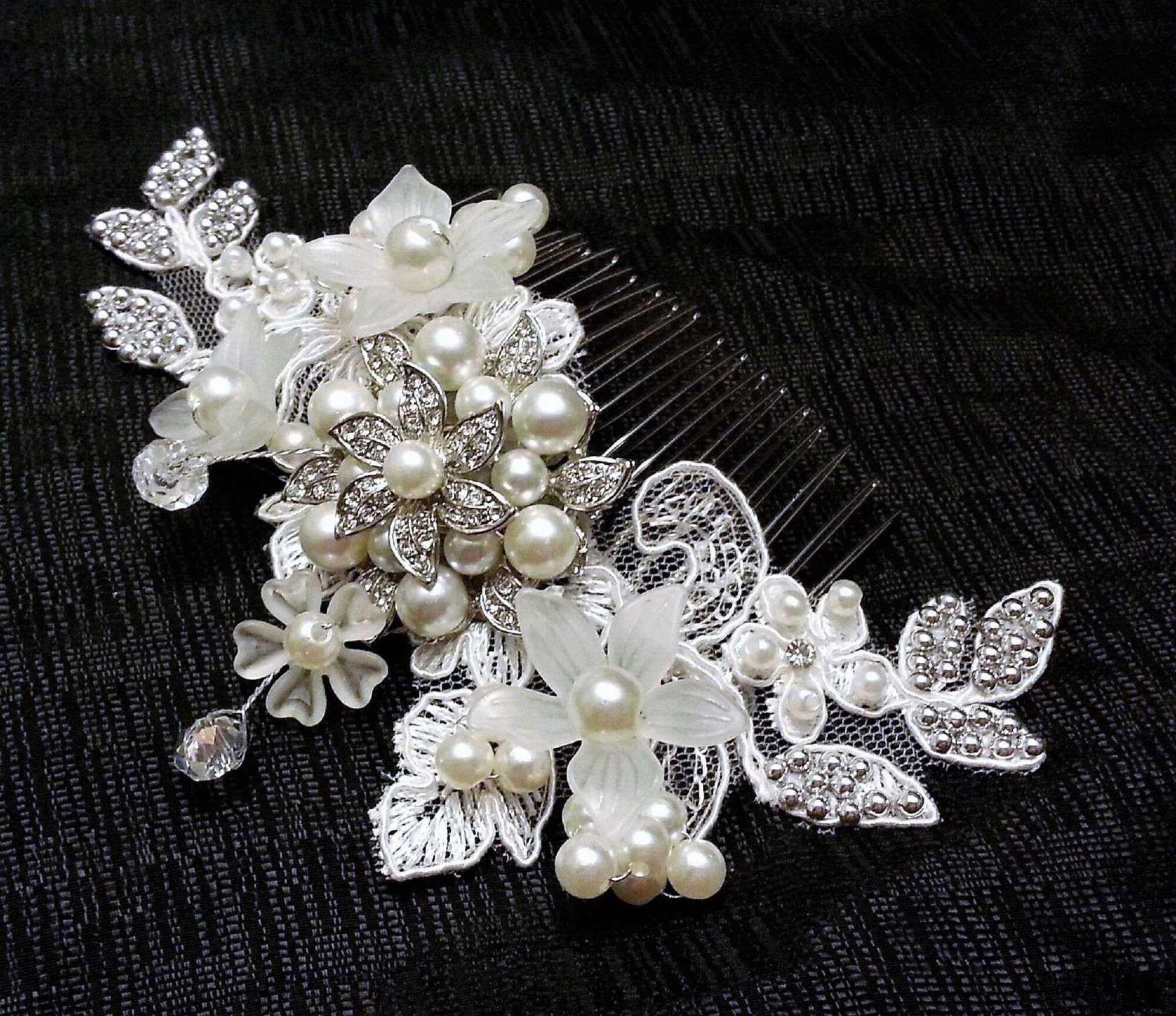 Bridal birdcage veil with floral lace and pearl headpiece on a comb.