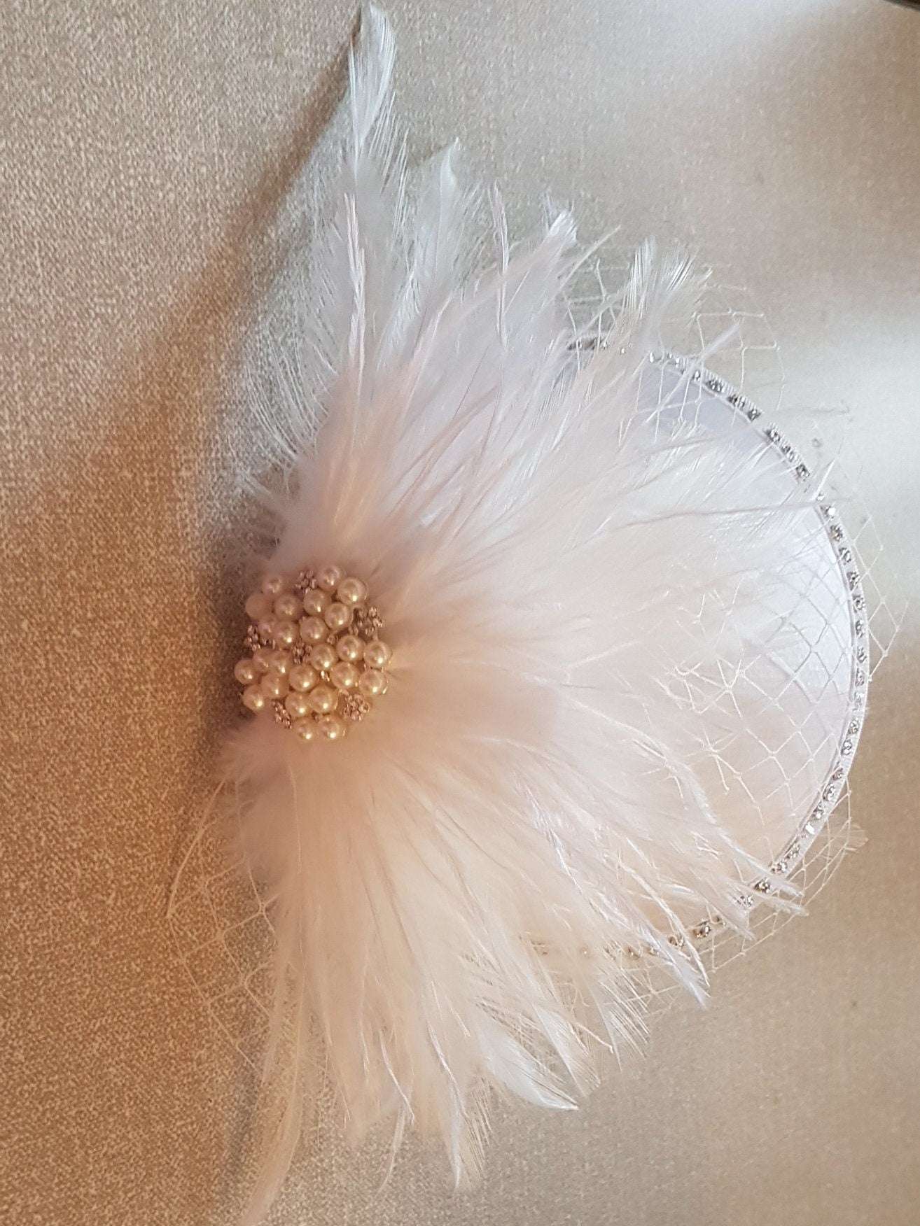 Feather hat fascinator with pearl and crystal jewel, French netting, wedding hair accessory.