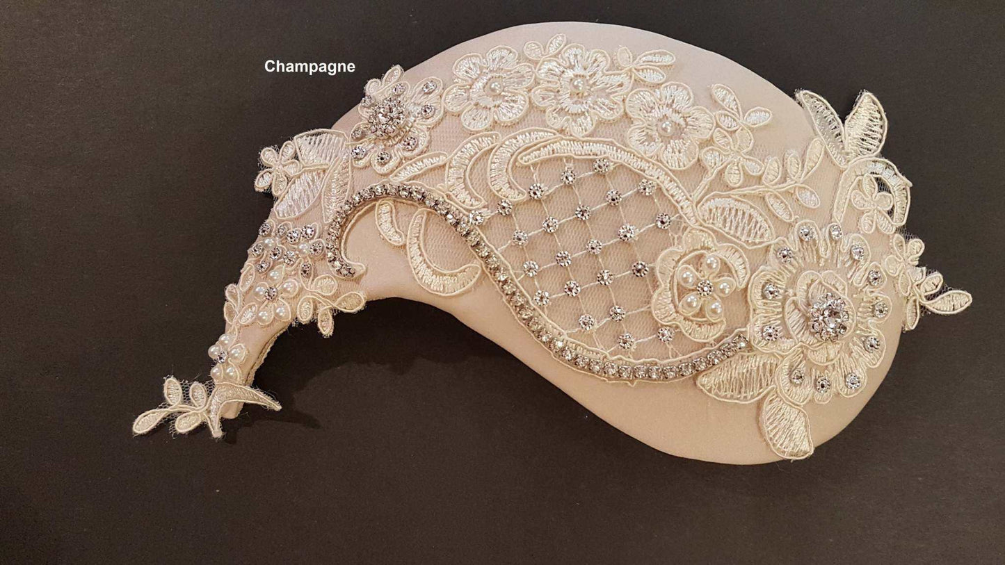 Champagne floral bridal birdcage veil fascinator with ornate crystal embellishments.