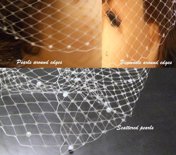 White and ivory bridal birdcage veil with pearls, diamante edges, and scattered pearls, showcasing detailed net design.