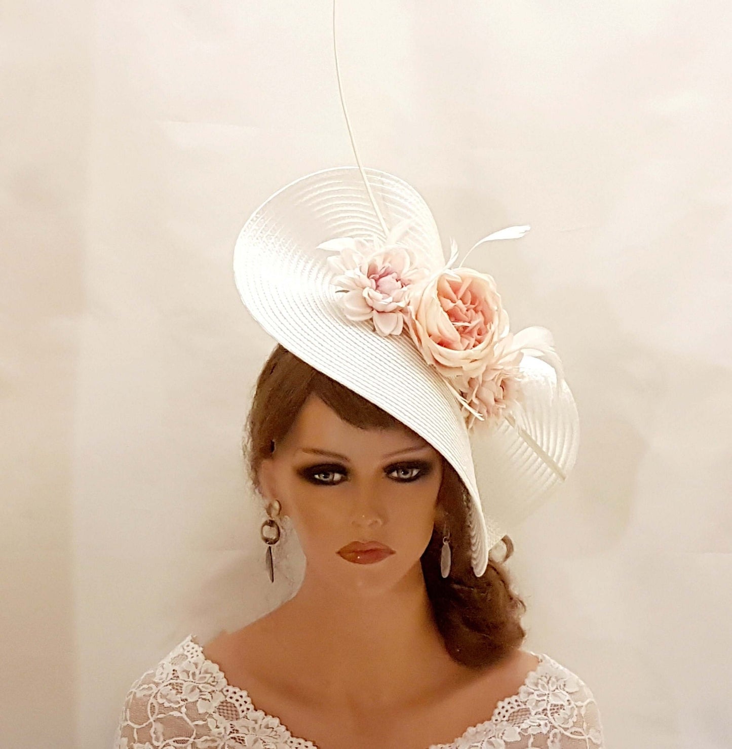 White and blue mother of the bride fascinator hat