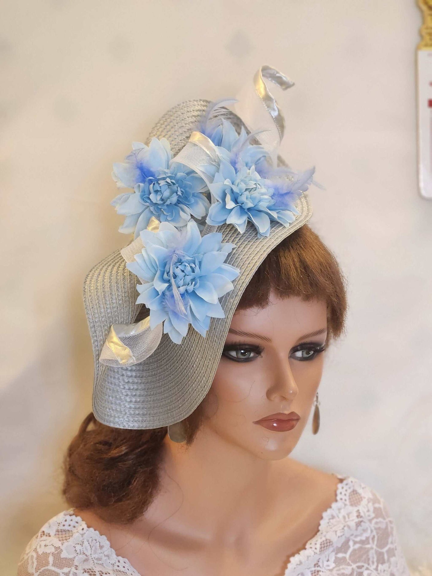 Silver & Blue fascinator with feather and flower details for weddings and races.
