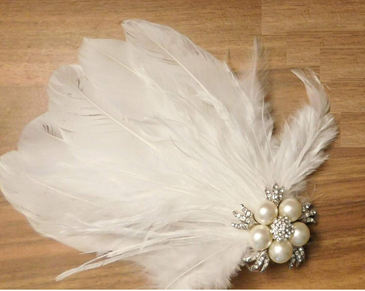 Bird cage veil fascinator with crystal pearl blusher and feather detail, 1920s Gatsby-inspired wedding hair accessory.