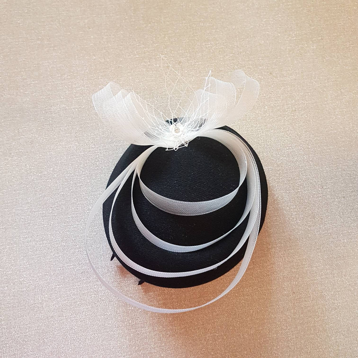 A small black hat fascinator for wedding, Ceremoney, Ascot, and tea party