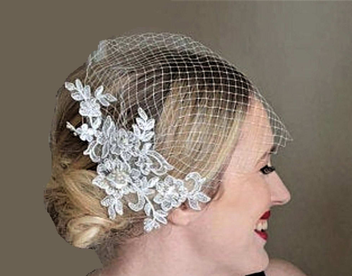 Bridal birdcage veil with white lace fascinator and pearls wedding hair accessory