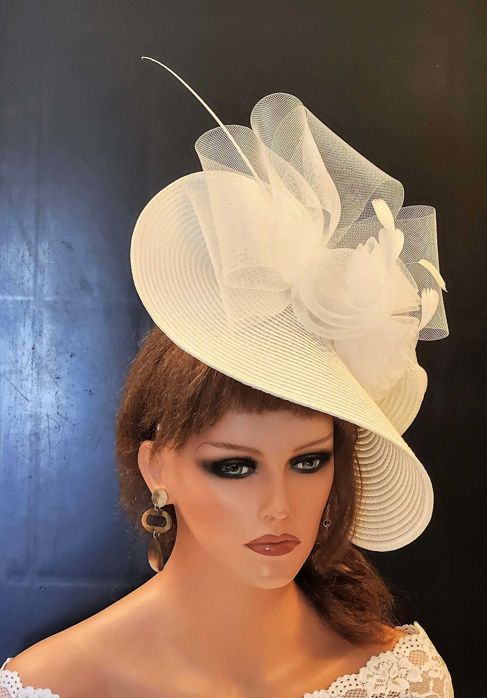 White mother of the bride fascinator with quill feather, crinoline roses, and straw weave design.