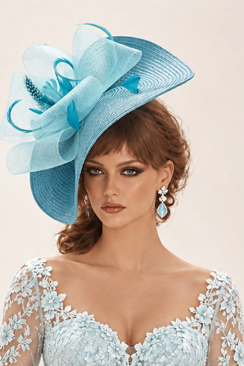 Large blue fascinator hat with turquoise blue feathers and crinoline loops.