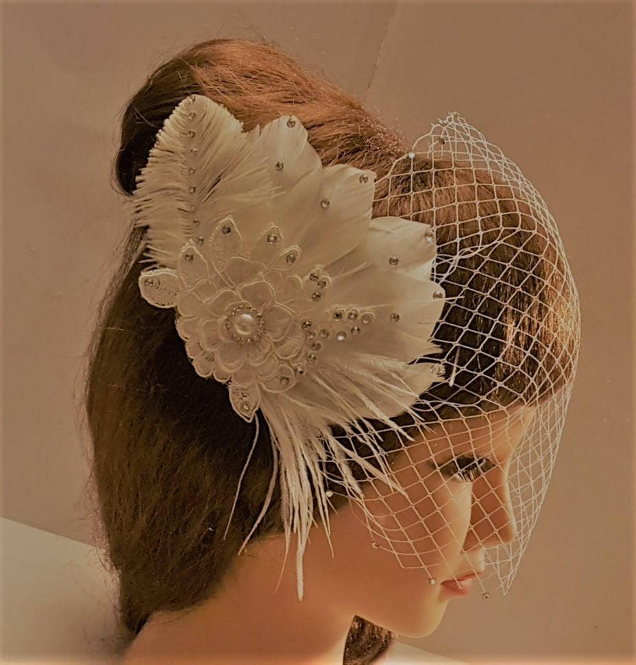 bridal veil with feathers and floral motif clip