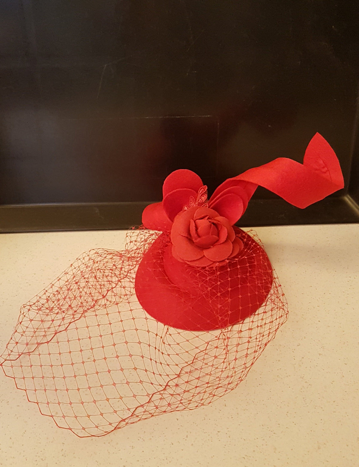 Red pillbox hat Fascinator with birdcage veil