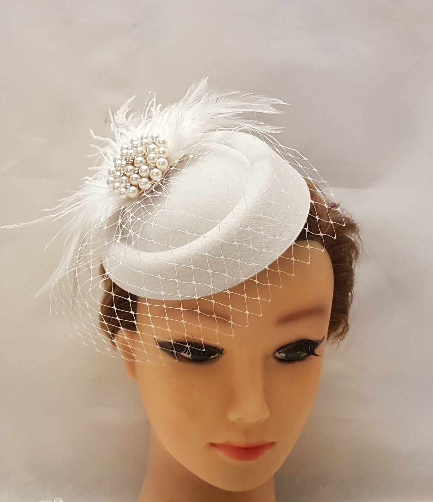 Feather fascinator hat