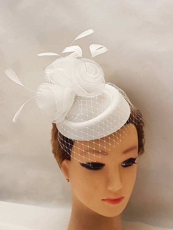 Bridal birdcage veil hat fascinator. White wedding fascinator for the bride.