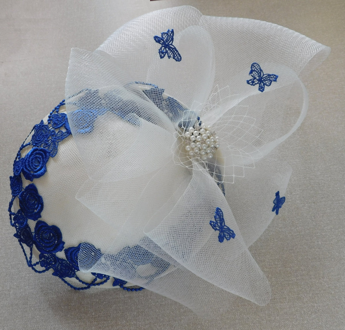 Ivory White Fascinator: Blue Floral Embroidery, Crinoline Bow, Pearl Jewel (Alice Band)