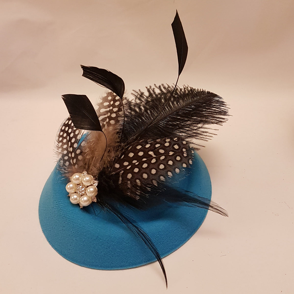 Turquoise blue pillbox hat fascinator with Ostritch feather and Pearl embellishment for Ascot, wedding and cocktail parties