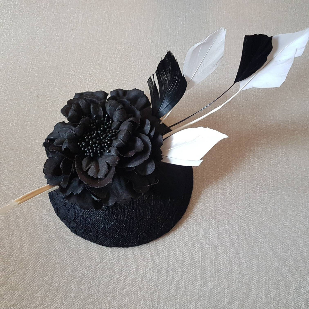Black fascinator with black and white Feathers