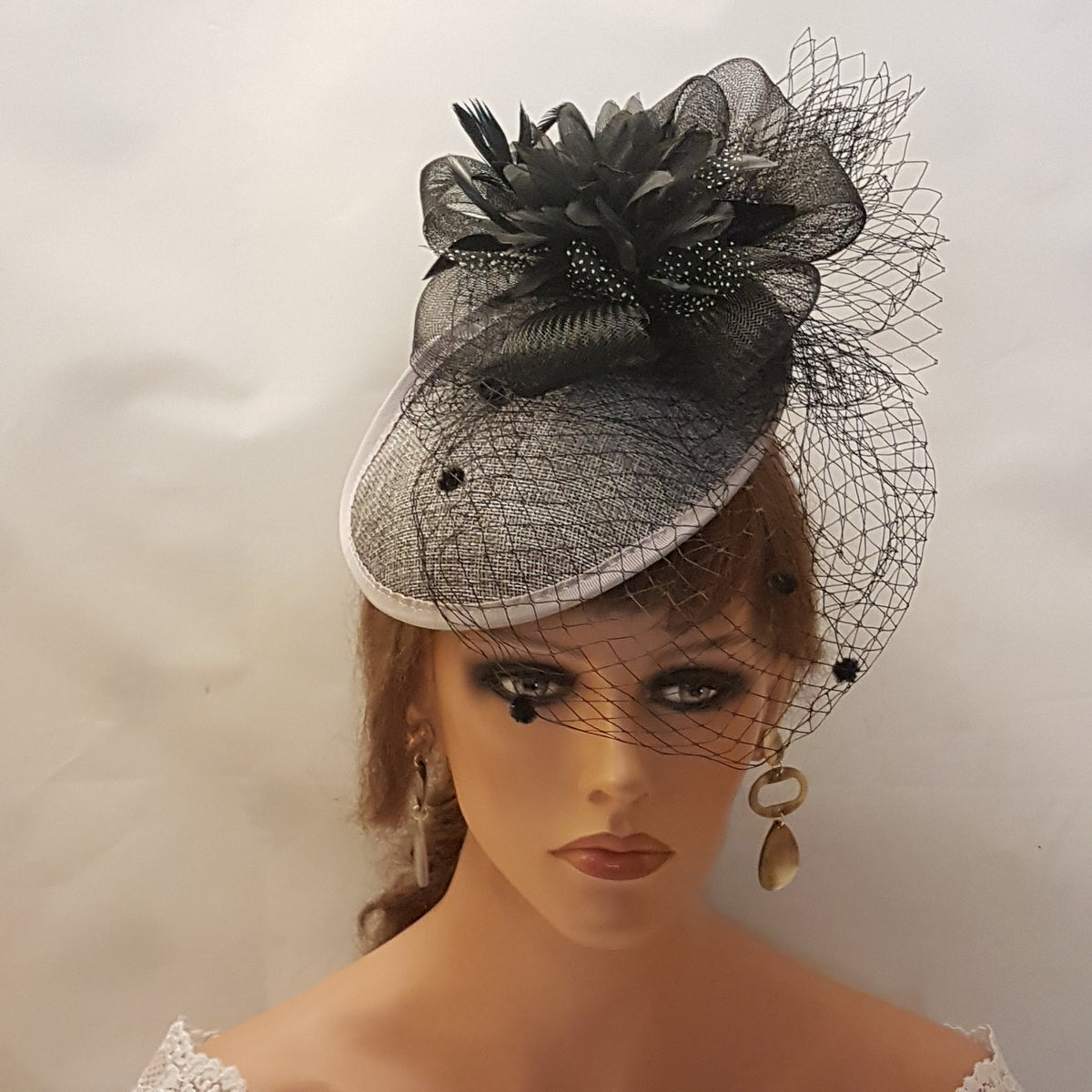 black and Grey hat with a black flower and veil