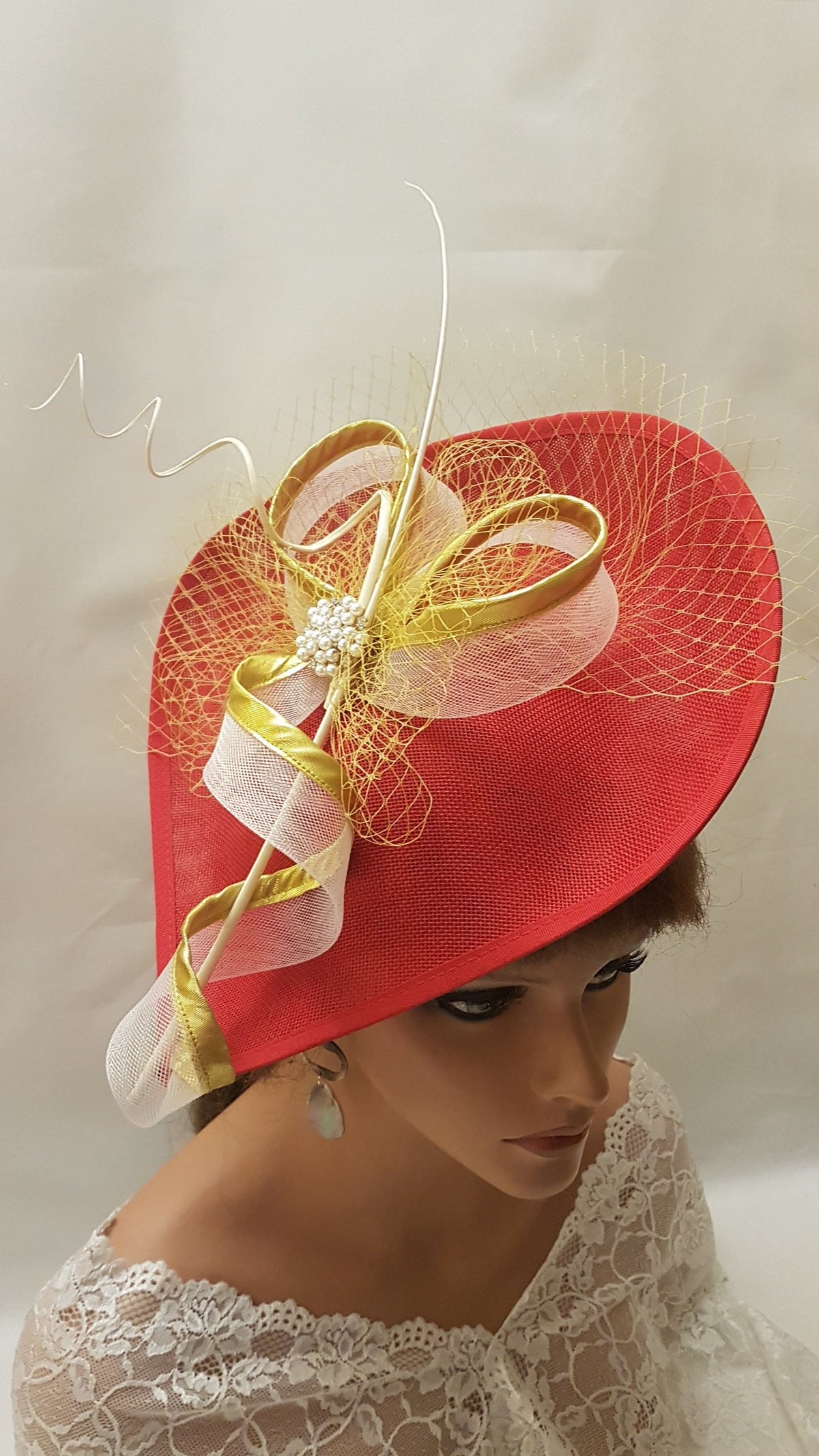 Red fascinator with  Gold
