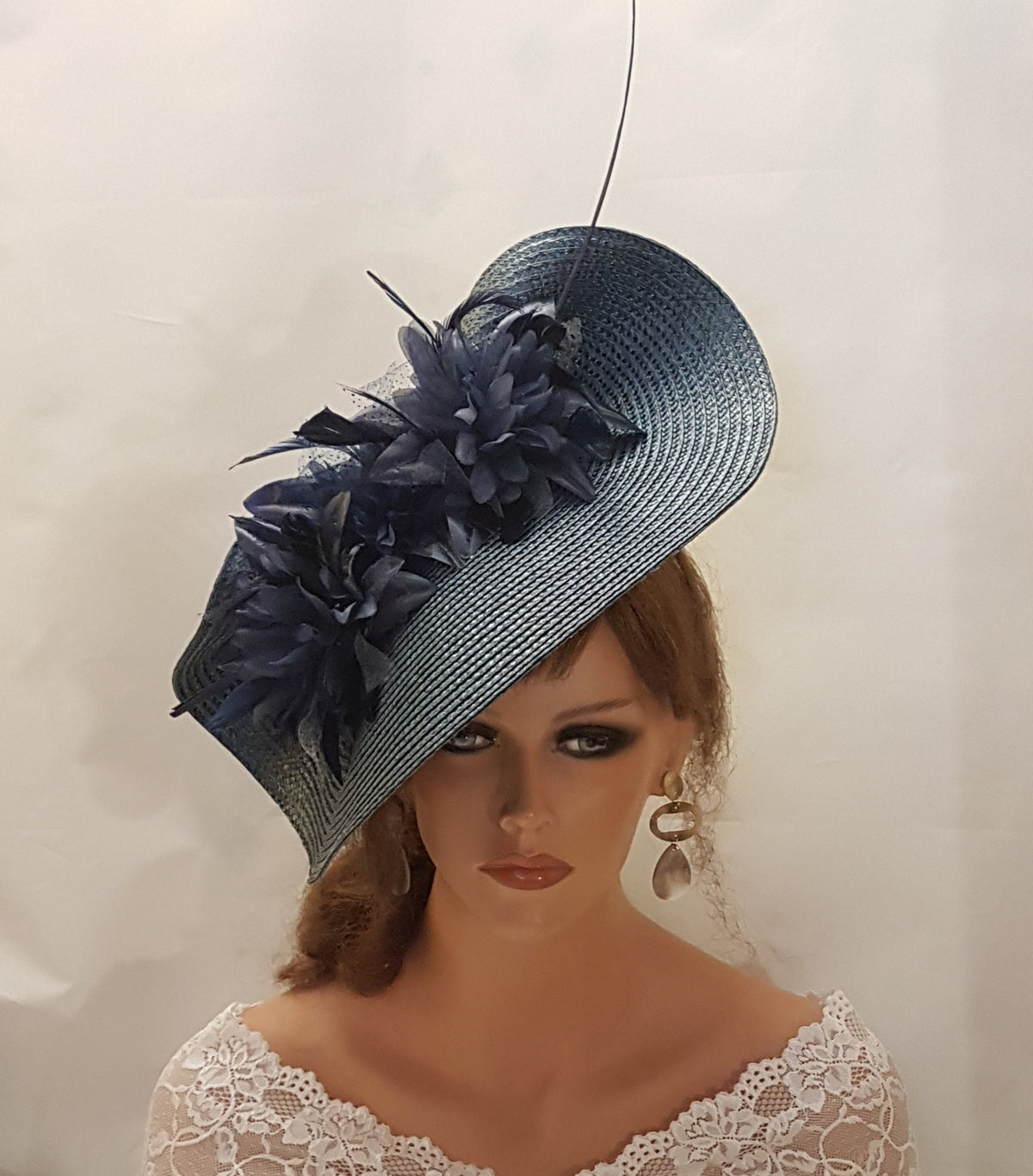 Navy Blue pp Straw hat with feathered Silk flowers and long quill feather.