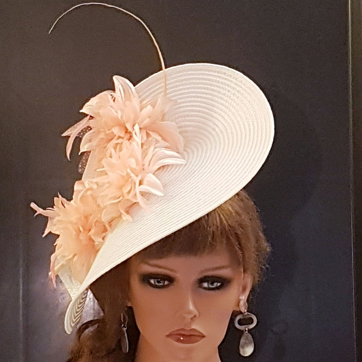 Mother of the bride  hat fascinator.  A white wide-brimmed hat with Pink flower  and feathers