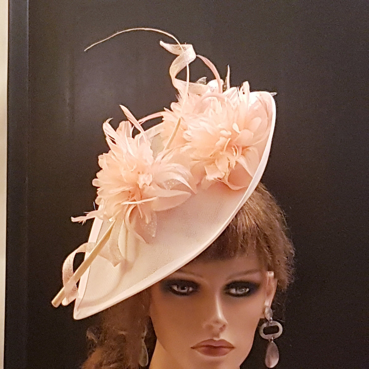 Mother of the bride hat fascinator with Feathers  and pink flowers