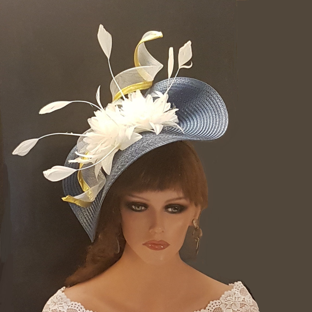 blue and white hat wi5h gold edge swril and feathers.