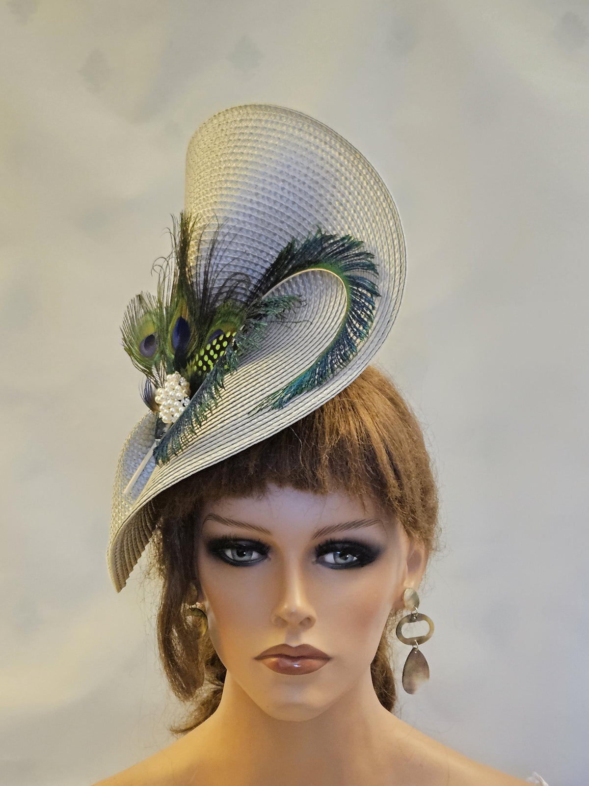 Silver grey mother of the bride hat fascinator with elgant Peacock Feathers