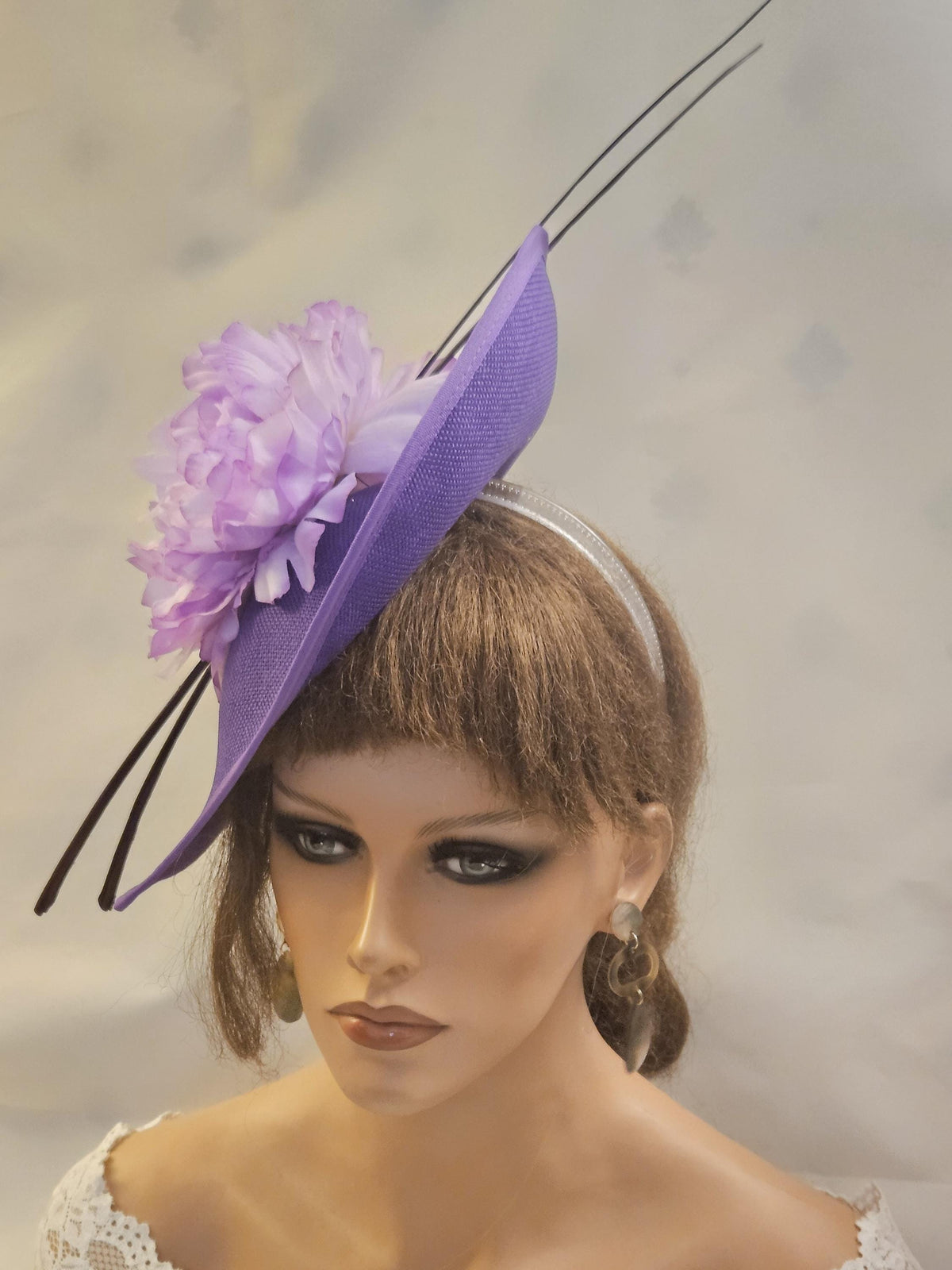 purple mother of the bride hat fascinator with long quil Feather