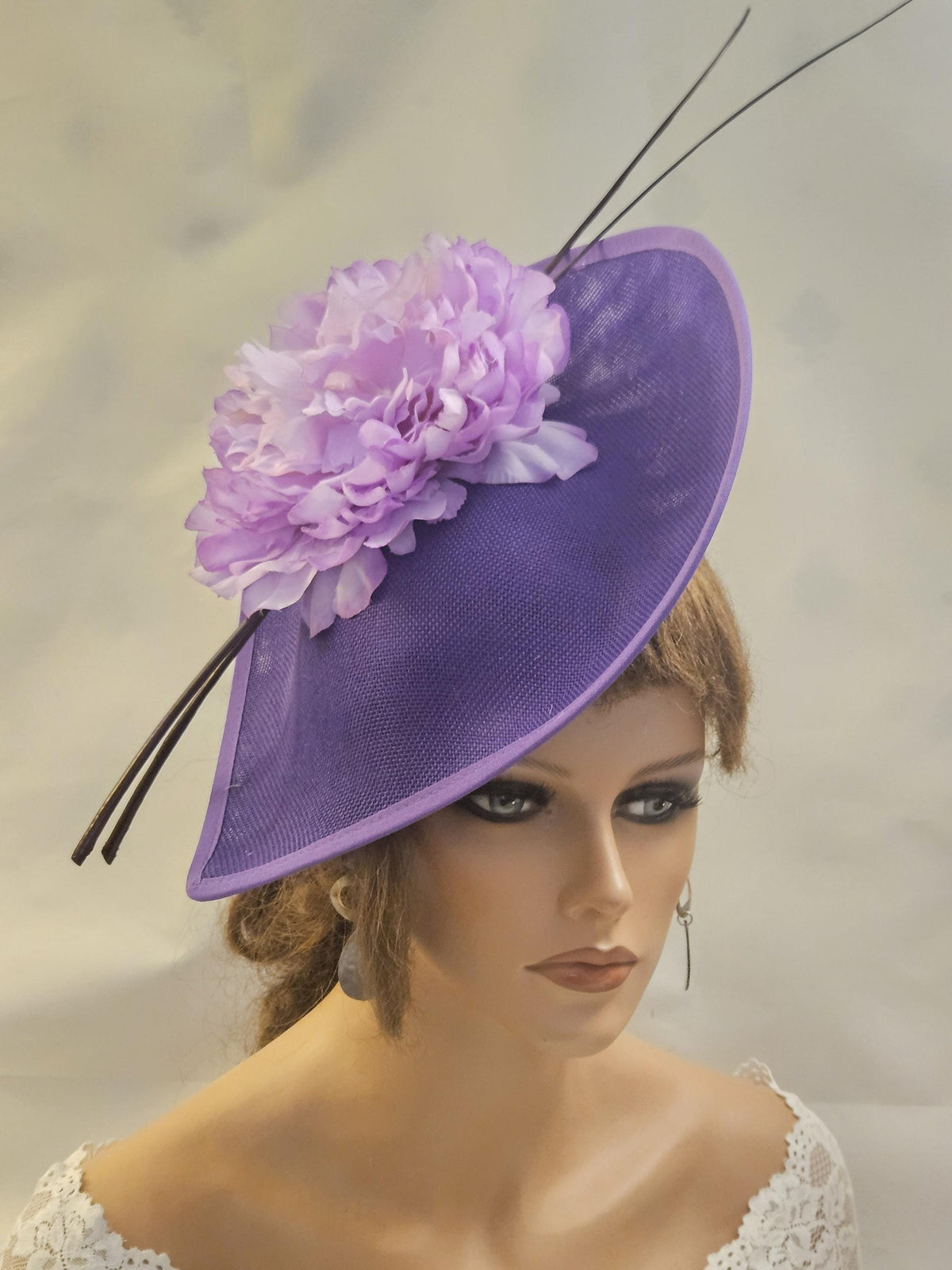 large purple fascinator hat for wedding
