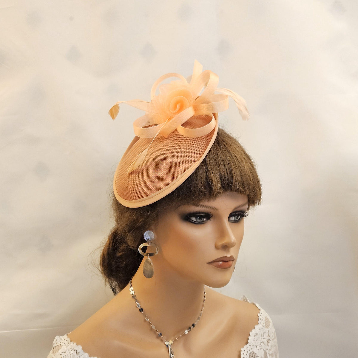 Peach fascinator hat