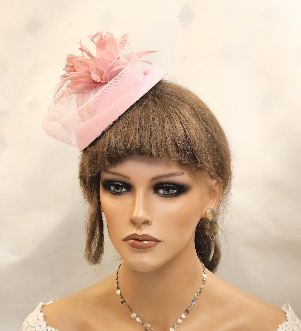 Pink fascinator with Felt pillbox hat base and and feathered flower and Crinoline loop beautifully arranged along with the ha base