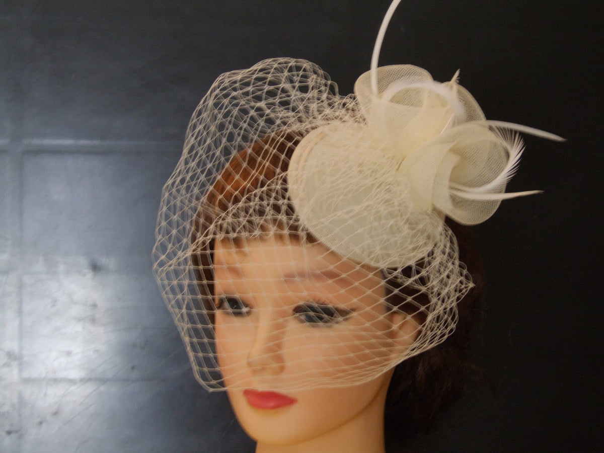 birdcage veil hat with crinolin and feather accent