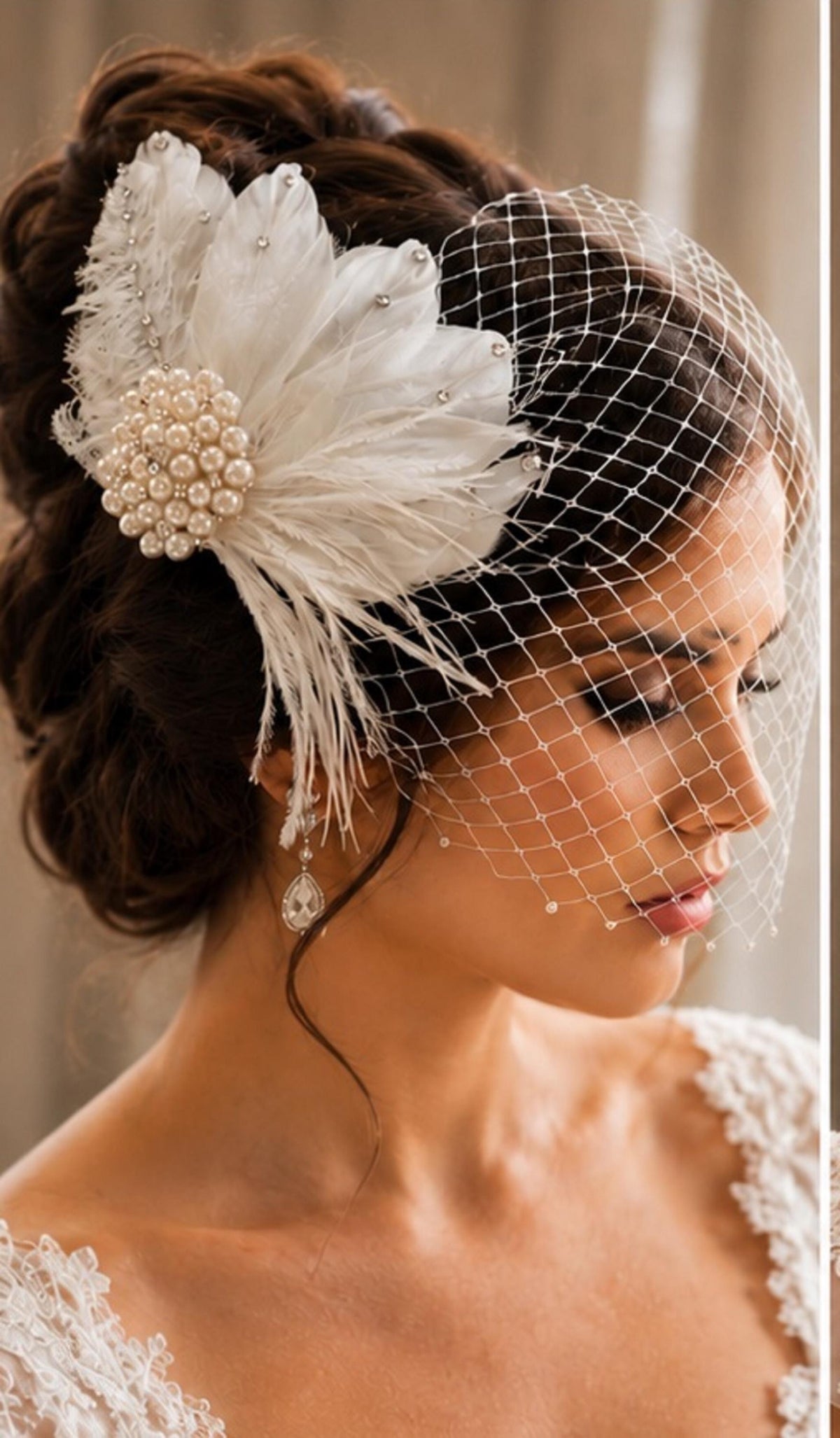 Bridal birdcage veil with feather fascinator clip