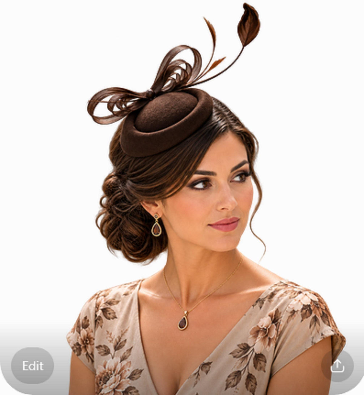 May include: A dark brown felt fascinator hat featuring a structured round base, decorative looped ribbons, and two upright leaf-shaped accents. The headpiece is paired with a gold-toned necklace featuring a teardrop pendant and matching earrings.