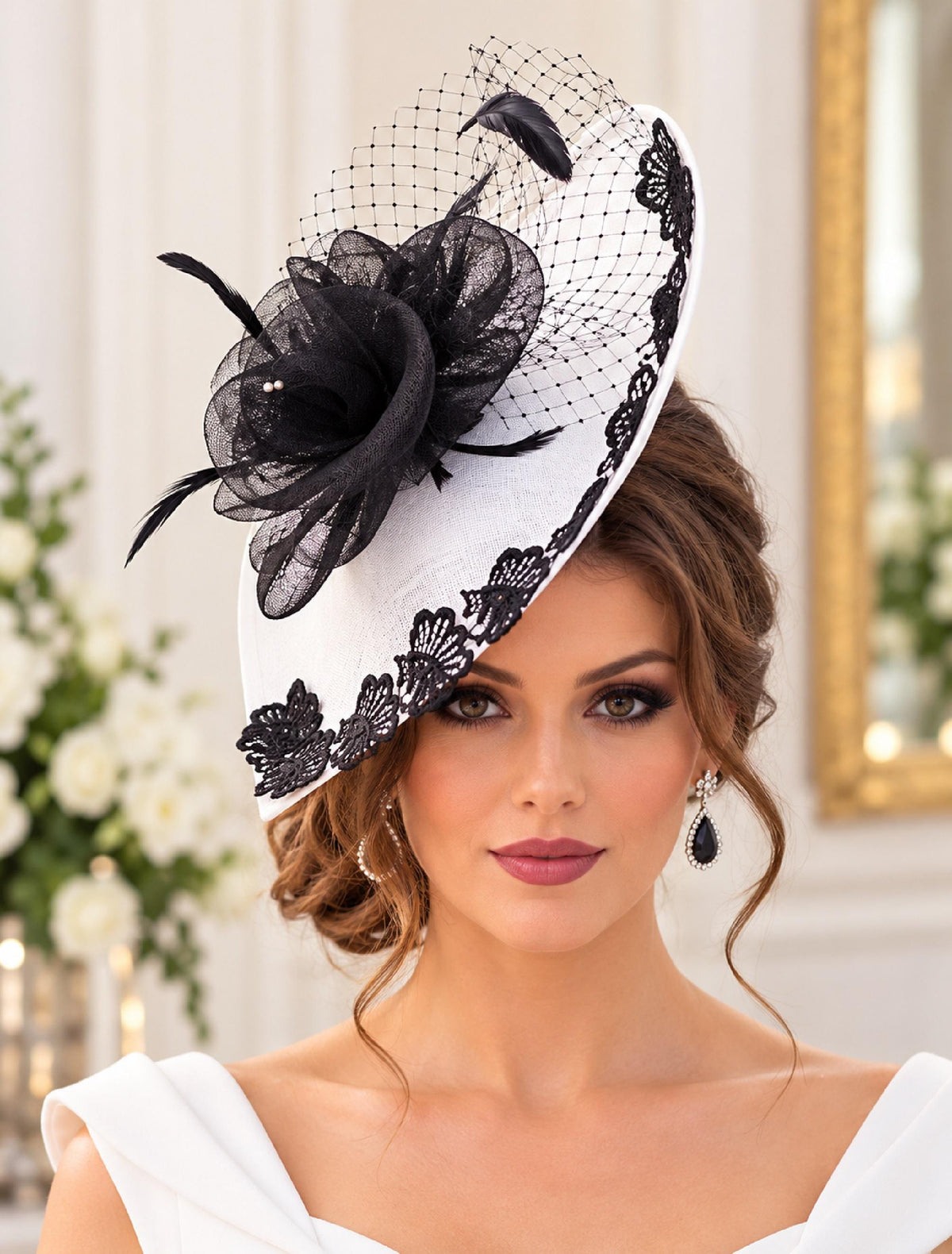 White fascinator hat with black lace trim, black flower, feathers and birdcage netting.