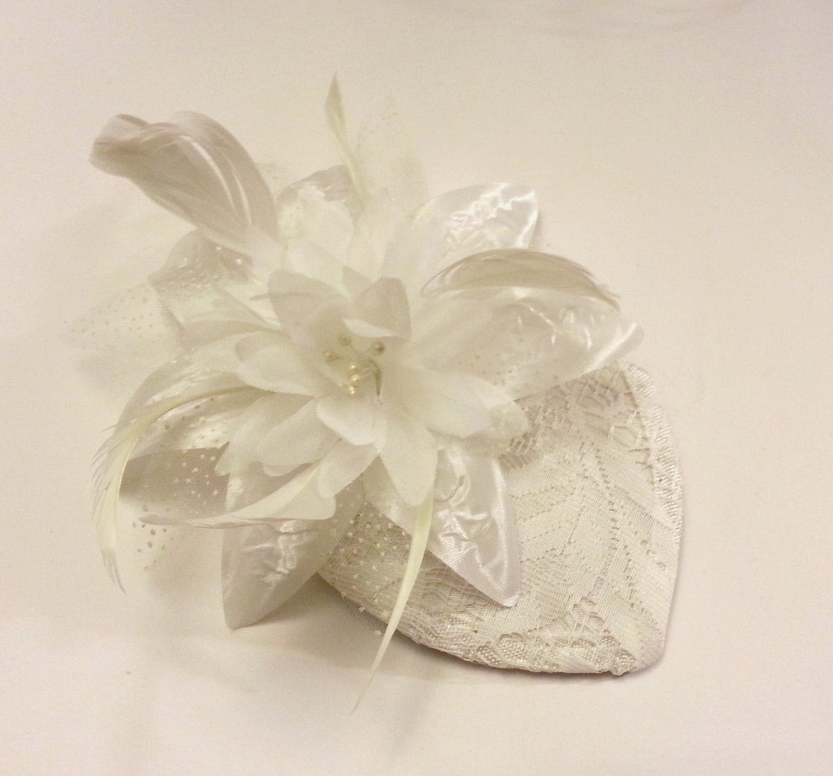 Bridal Fasinator hat with flower and feathers