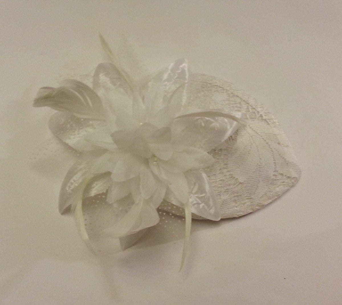 Bridal lace hat with flower and feather